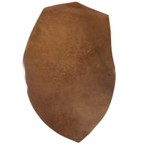 Shell cordovan leather tends to be ovoid in shape since it's taken from the flat muscle tissue on the rump of a horse.