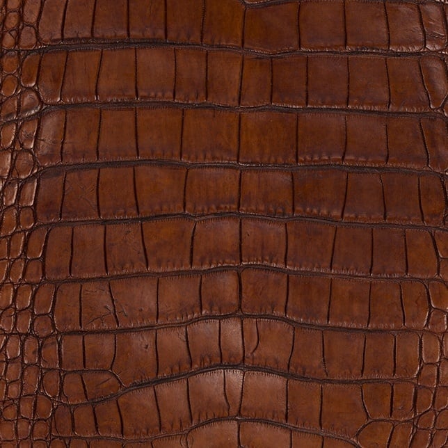 Leather making process using crocodile skin is a skill.